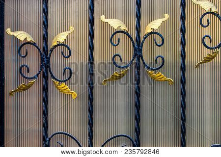 Details, Structure And Ornaments Of Forged Iron Gate. Floral Decorative Ornament, Made From Metal. V