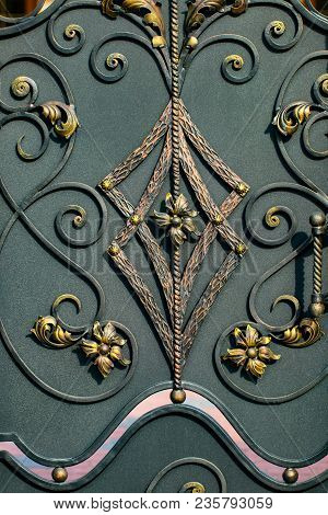 Details, Structure And Ornaments Of Forged Iron Gate. Floral Decorative Ornament, Made From Metal. V