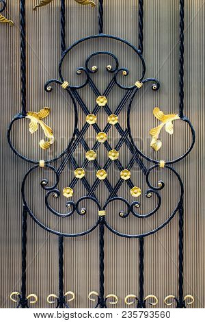 Details, Structure And Ornaments Of Forged Iron Gate. Floral Decorative Ornament, Made From Metal. V