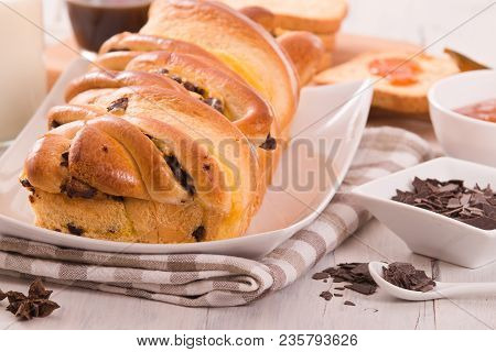 Brioche With Chocolate Chips On White Dish.