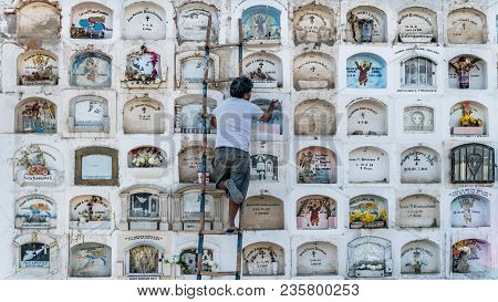 Ica, Peru - August 2017: A Keeper Is Taking Care Of The Above The Ground Tombs In The Ica Cemetery I