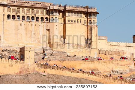 Amer, India - March 17, 2017: Famous Amer Historical Fort With Elephants Transferring Tourists To Th