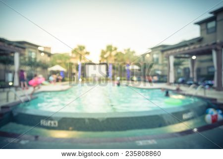 Blurred Pool Party With Inflatable Outdoor Projector In America