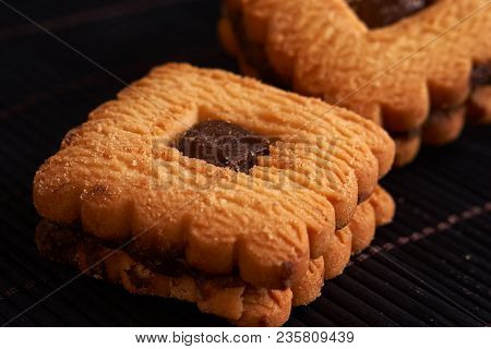 Stacked Chocolate Chip Cookies On Black Table
