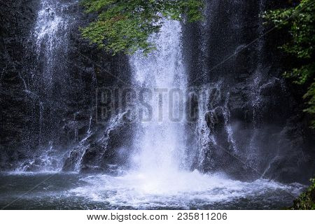 Water Splashes Into A Pool At The Mino Waterfall In Northern Osaka