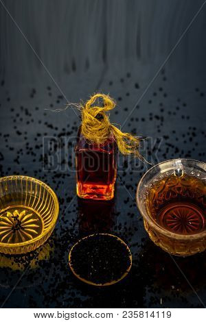 Close Up Of Ayurvedic Treatment Consisting Of Kalonji, Roman Coriander With Honey, Black Tea And Its