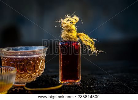 Close Up Of Ayurvedic Treatment Consisting Of Kalonji, Roman Coriander With Honey, Black Tea And Its