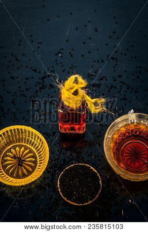 Close Up Of Ayurvedic Treatment Consisting Of Kalonji, Roman Coriander With Honey, Black Tea And Its