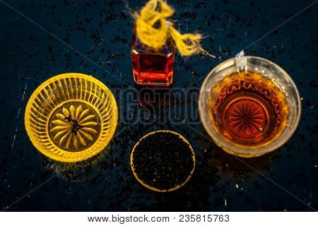 Close Up Of Ayurvedic Treatment Consisting Of Kalonji, Roman Coriander With Honey, Black Tea And Its