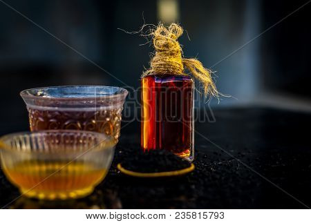 Close Up Of Ayurvedic Treatment Consisting Of Kalonji, Roman Coriander With Honey, Black Tea And Its
