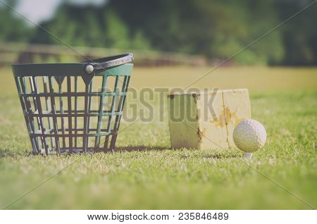 Golf At The Driving Range Four Or Is It Fore... Basket With Golf Balls At The Rough Zone Of Course