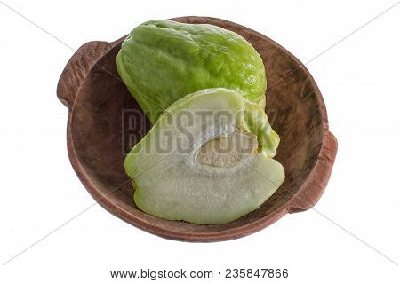 Isolated Closeup Of Chayote In A Rustic Wooden Bowl