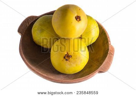 Araza Fruits In A Wood Bowl Isolated On White