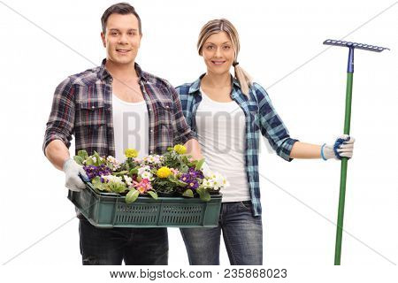 Male gardener with a rack of flowers and a female gardener with a rake isolated on white background