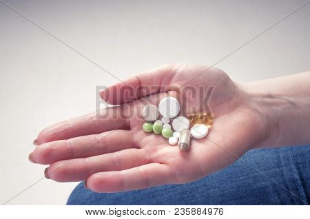 Multicolor Pills In Your Palm, Medications In Woman's Hand