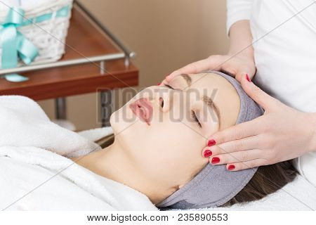 Facial Massage For A Beautiful Girl In A Spa Salon
