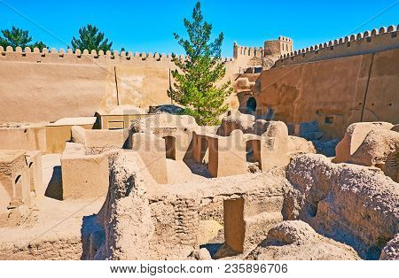 The Small Living Buildings Of Ancient Rayen Citadel Are Surrounded By Huge Adobe Ramparts With Watch