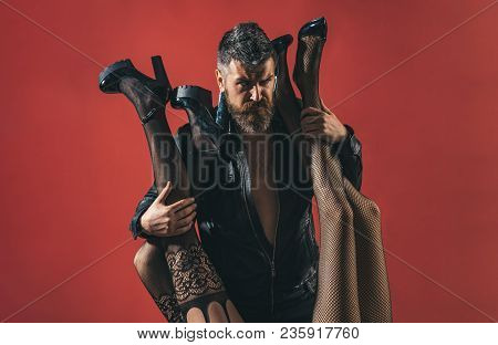 Womanizer. Bearded Brutal Man With Female Legs In Sexy Pantyhose. Seductive Sensual Relationship. Pa