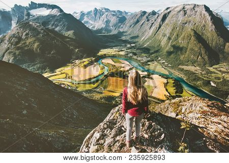 Traveler Girl Standing On Cliff Above Mountains Valley Landscape Traveling Solo Adventure Lifestyle 