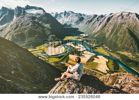 Man Traveler Relaxing On Cliff Alone Aerial Mountains Valley Landscape Traveling Adventure Lifestyle
