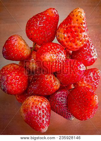 Strawberry On A Wood Table.strawberry Group.strawberry Love.