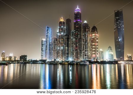 Night View Of Dubai Marina With Reflectons In The Harbour