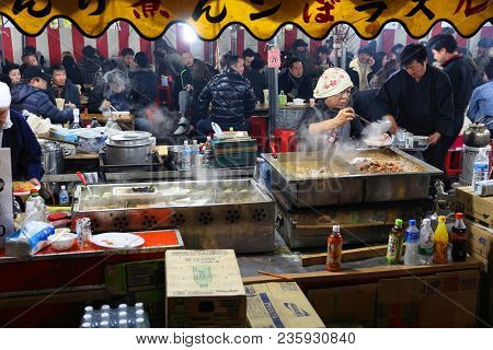 Chichibu, Japan - December 3, 2016: Vendor Prepares Street Food At Chichibu Night Festival In Japan.