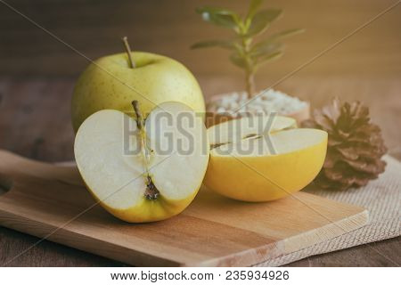 Cross Section Of Fresh Shinano Gold Apple From Japan. Cut An Apple Put On Wood Table With Copy Space