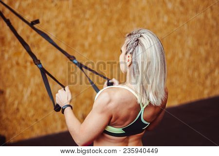 Beautiful Woman Is Doing Exercises In The Sport Club.