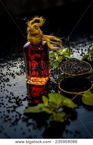 Close Up Of Kalonji, Roman Coriander, Mint Leaves, And Powder Of Kalonji With Its Extracted Oil For