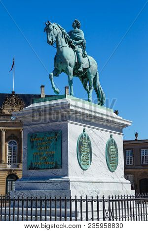 Copenhagen, Denmark- May 03, 2013: Amalienborg, Riding Statue Of King Frederick V. In The Background