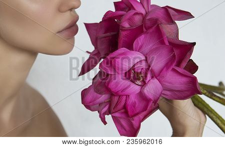 Woman Holding A Pink Flowers Lotus Close-up. Beautiful Girl With Big Exotic Flower Bouquet. Lotus