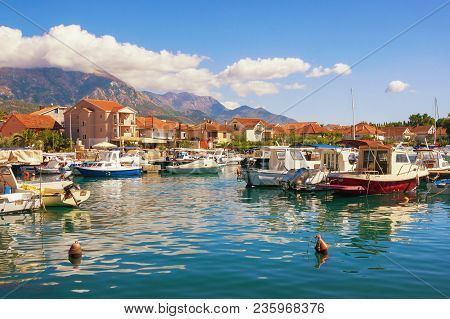 Sunny Landscape With Fishing Boats In Harbor. Montenegro, Marina Kalimanj In Tivat City