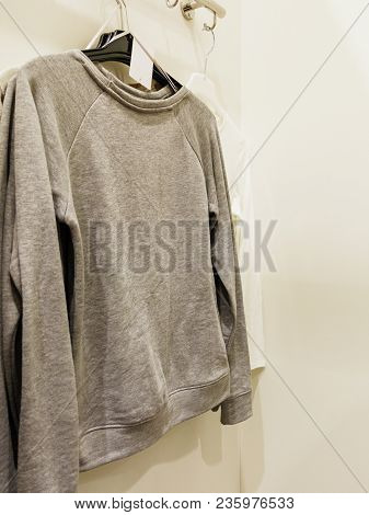 Shopping Time Concept. Garment Fashion Clothes In Botique Shop Market. New Collection Hanging In Sto