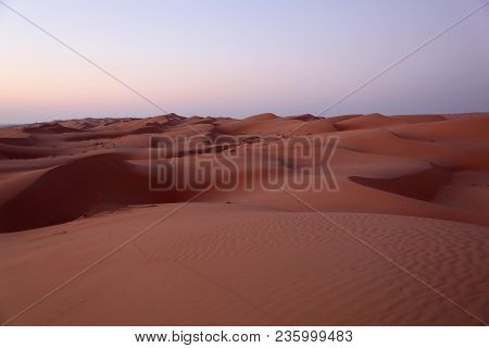 Morning Sunrise On The Red Sharqiya Sand Dunes Of Oman