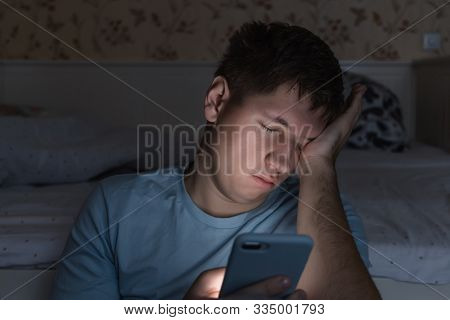 Adult Sleepy Man Awake Late At Night In Bed Surfing In Web, Can Not Fall Asleep/ Sleepy Tired, Socia