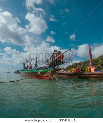 Tropical Thai Sea And Wooden Boat With Car Engine