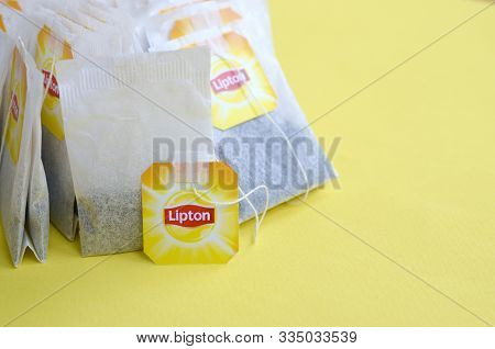Lipton Yellow Label Black Tea Bags On Pastel Yellow Surface Close Up. Lipton Is A World Famous Brand
