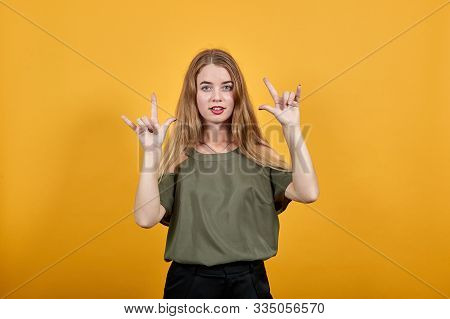 Young Beautiful Blonde Woman Wearing Haki Shirt Over Isolated Orange Background Smiling And Laughing