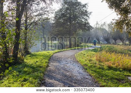 Winding Bicycle Path Along The Small De Loet River In The Krimpenerwaard In The Netherlands