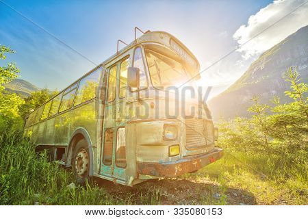 Ulvik, Norway, Europe - June 15, 2014: Sunlight Through The Windows Ad An Abandoned Bus Wreck In The