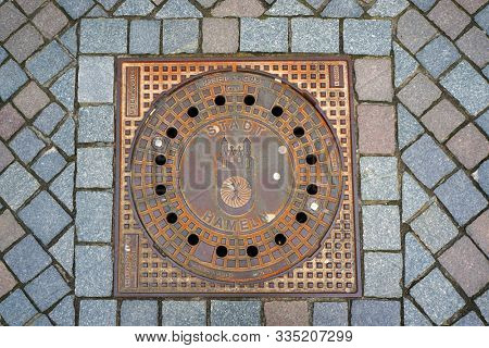 Hameln, Germany - April 20, 2016: Emblem of city Hameln on an iron manhole cover.