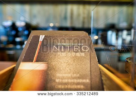 SHENZHEN, CHINA - CIRCA FEBRUARY,  2019: close up shot of Starbucks Cold Brew Nitro sign at Starbucks in Shenzhen.