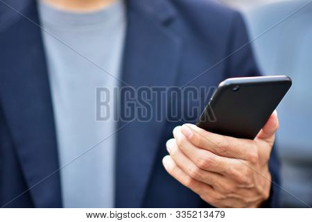 Businessman Holding Cell Phone Using Mobile Phone Or Smart Phone Telephone To Call Phone With Social