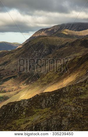 Majestic Autumn Fall Landscape Image Of Mountain Peaks In Lake District Near Buttermere With Gorgeou