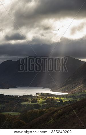 Epic Sun Beams Light Up Crummock Water In Dramatic Autumn Fall Landscape Image With Mellbreak And Gr