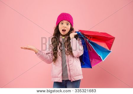 Falling Prices. Surprised Shopper Presenting Product Pink Background. Small Child On Shopping Sale. 