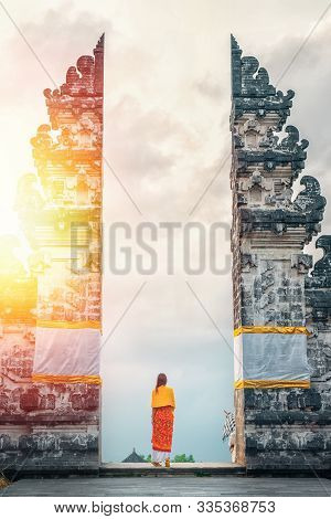 Young Woman Tourist Visiting Lempuyang Temple, Bali Indonesia. Sunlight