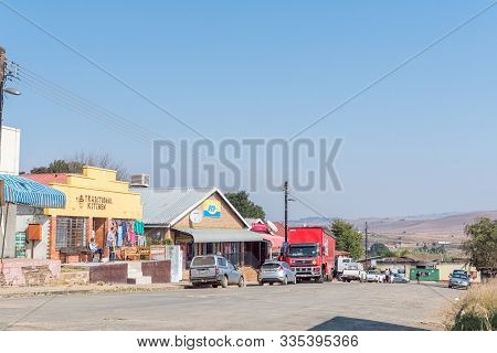 Machadodorp, South Africa - May 22, 2019: A Street Scene, With Businesses And Vehicles, In Machadodo