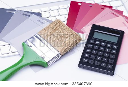 The Photo Shows Various Color Cards With A Flat Brush And A Calculator On A Keyboard